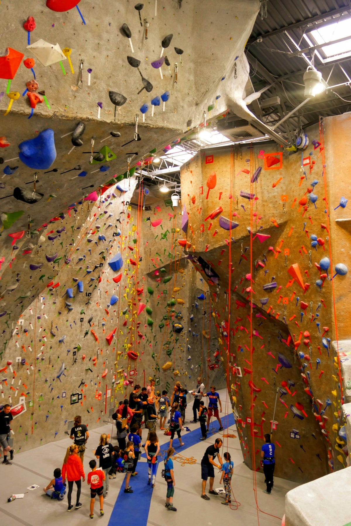 People in an indoor climbing gym