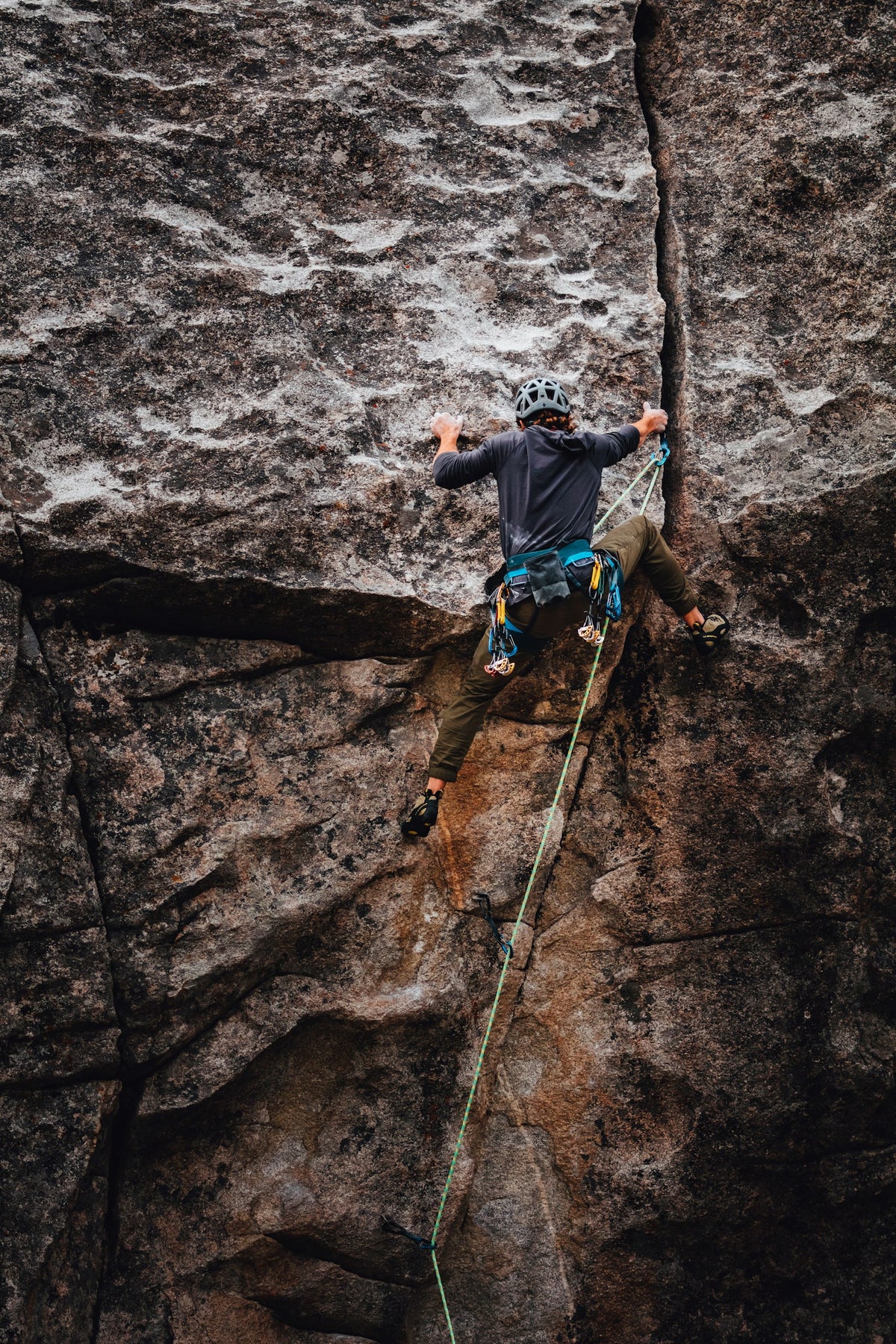 Climber on brown rock in daylight