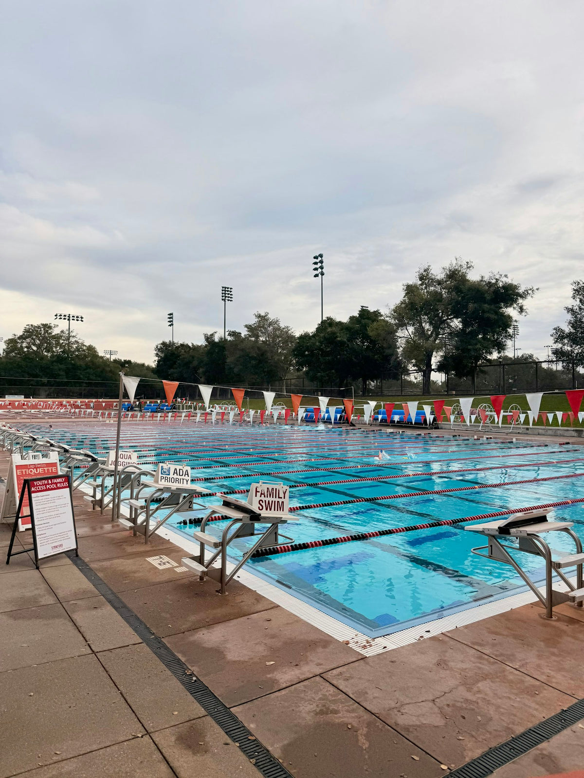 Outdoor swimming pool with lanes and diving blocks
