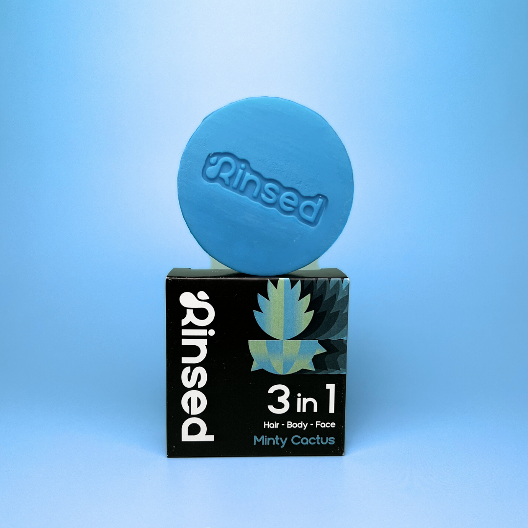 Blue Minty Cactus bar standing on its black Rinsed™ 3 in 1 packaging box