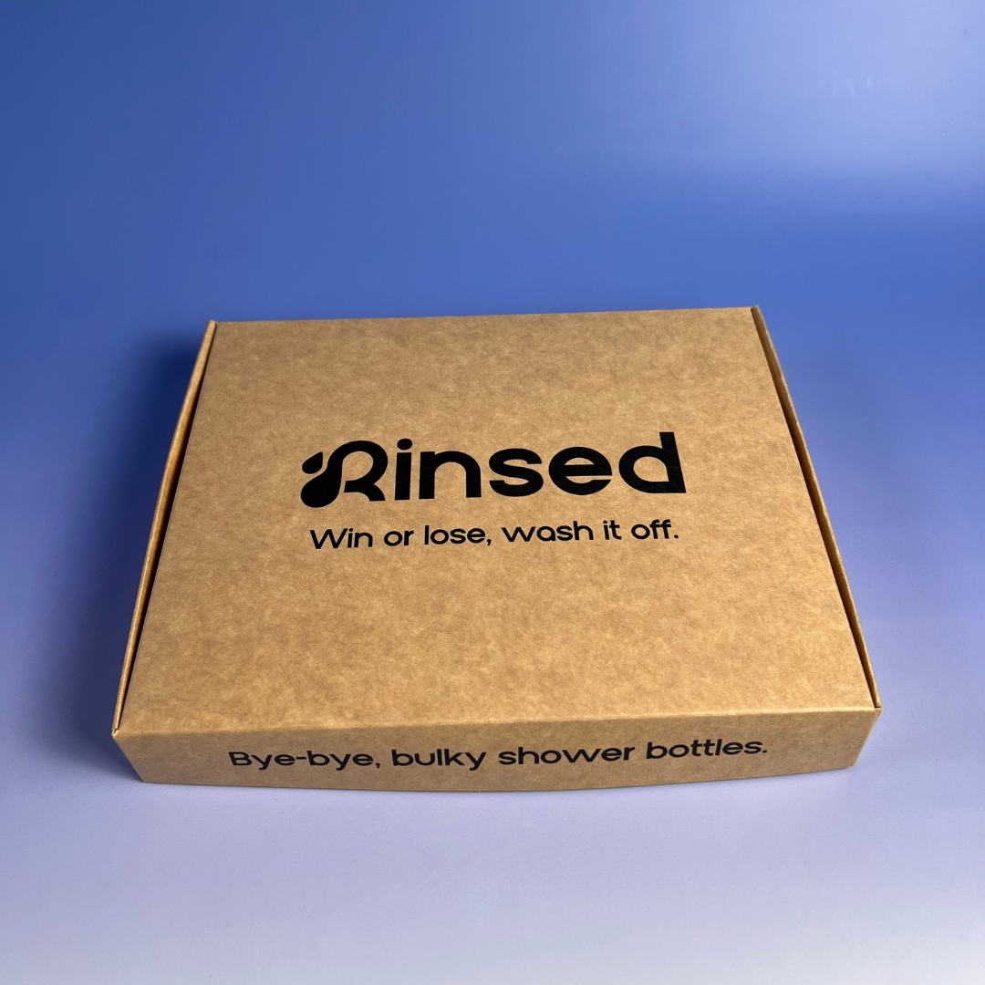 Closed kraft Rinsed™ gift box with the line Win or lose, wash it off