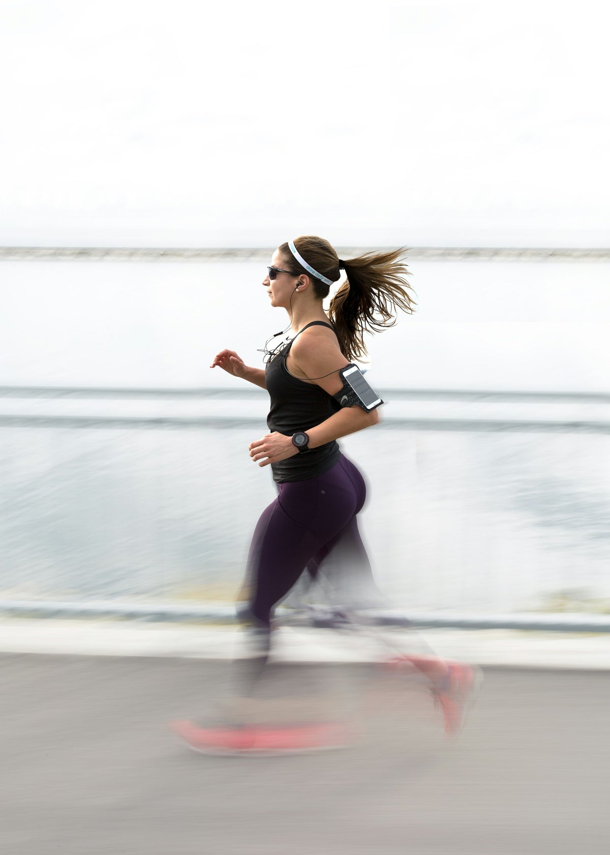 Woman running with an armband
