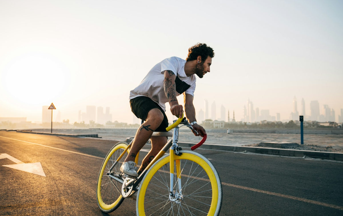 Cyclist riding on a road in daylight