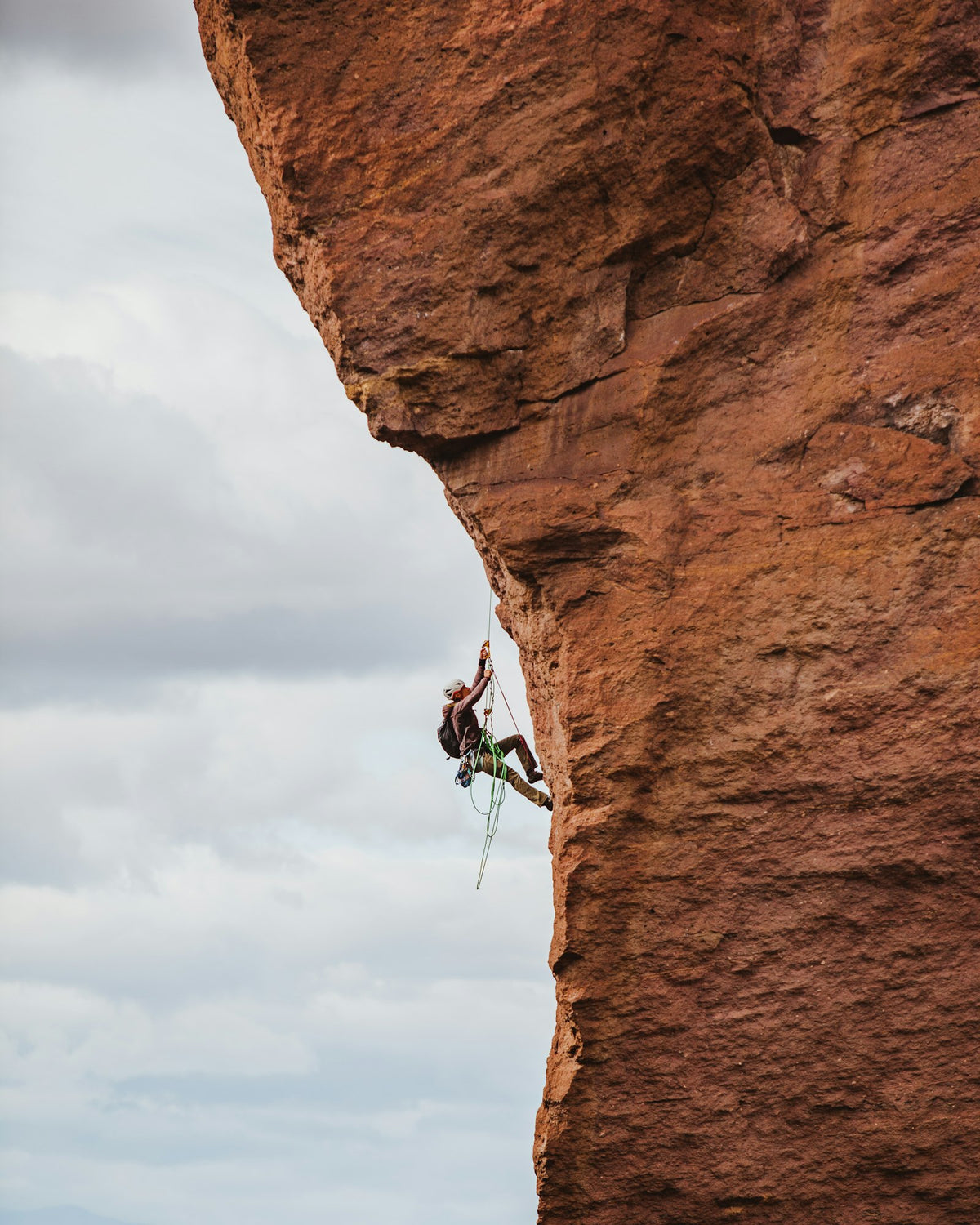 Climber on a brown rock formation