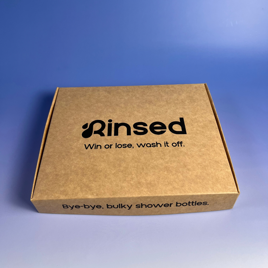 Closed kraft Rinsed™ gift box with the line Win or lose, wash it off