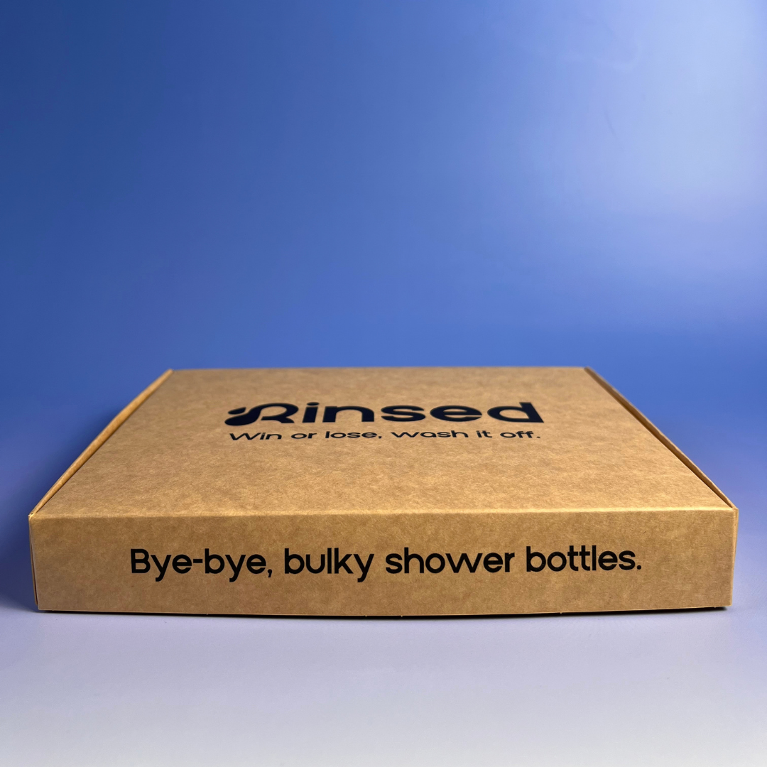 Side of the Rinsed™ gift box reading Bye-bye, bulky shower bottles
